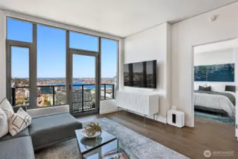 Floor to ceiling windows take in fantastic northern views of Lake Union, the Space Needle, and even Mt. Baker!