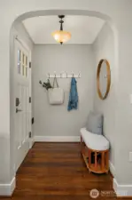 Coved ceilings and welcoming formal entry.
