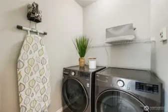 Well-appointed laundry room located upstairs