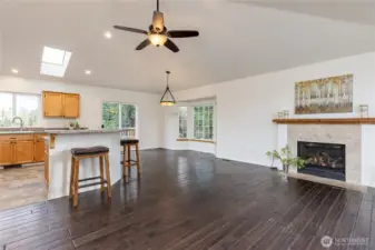 Bright and open main living area with vaulted ceilings. Fresh interior paint throughout!
