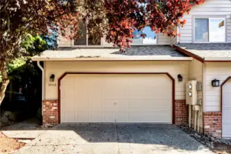 Front of home featuring two car attached garage.