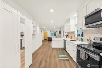 Spacious modern kitchen with pantry storage.