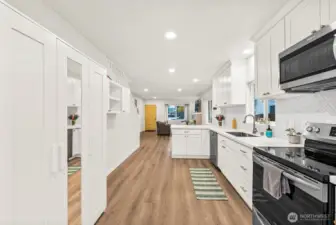 Spacious modern kitchen with pantry storage.