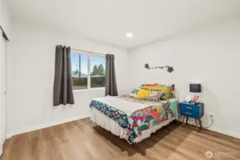 Main floor bedroom 1. Looks out to backyard.