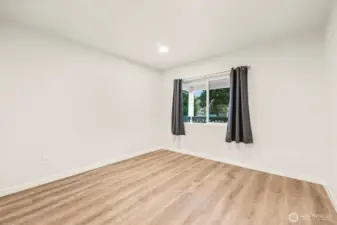 Main floor bedroom 2. Looks out to front yard.