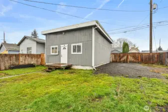 Huge garage/shop with RV parking. Alley access. Fully fenced yard.