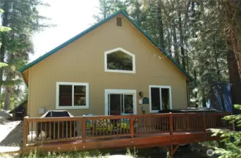Back of home with deck