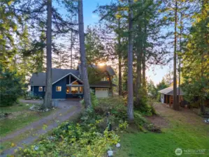 Driveway side of home. Tons of parking and space for gardening.