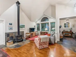 Open concept. Wood stove. Light and bright.