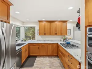 Beautiful custom craftsman kitchen. SS appliances. Double oven.