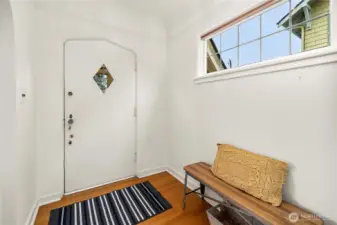 Enter the foyer which has easy access to living room, upper level, or the kitchen.