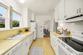 Kitchen boast counterspace and lots of cabinets.