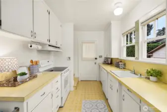 Returning to the kitchen we can exit through the backdoor to a mudroom to the backyard or the detached garage.