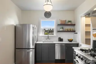 Cool lighting fixture, neat gas range, open shelving! Friendly & functional kitchen - your culinary playground!
