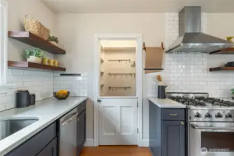 Cool lighting fixture, neat gas range, open shelving! Friendly & functional kitchen - your culinary playground!