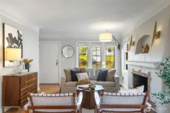 Seamless combo of original charm (leaded-glass, anchoring fireplace, coved ceilings) & contemporary updates  (swanky lighting fixtures, updated kitchen and baths).