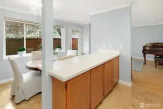 Kitchen island provides a breakfast bar and ample counter space.