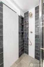 Beautiful tile detail in this glass shower.