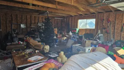 Double garage interior to be cleaned up.
