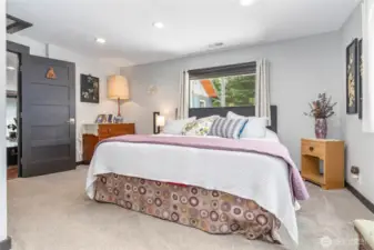Another view of the primary bedroom with custom blinds
