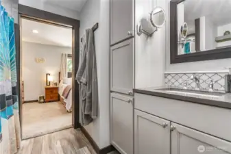 Another view of the primary bathroom and cabinetry
