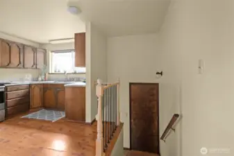 Back stairs lead you to back covered porch and down to the laundry room.