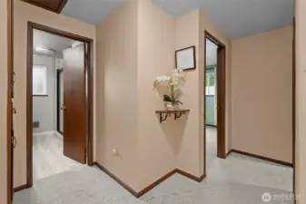 Hall bathroom on the left and primary bedroom on the right.