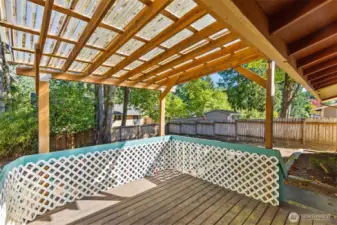 Covered deck with view of huge back yard! Bring on the rain!