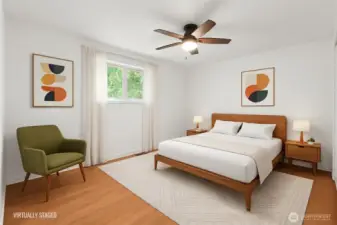 Primary bedroom (virtually staged) faces back yard.