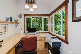 Office overlooking salmon-filled creek with door to deck