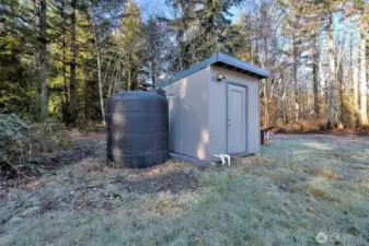 The well pump house, along with a nice big holding tank for additional water pressure.