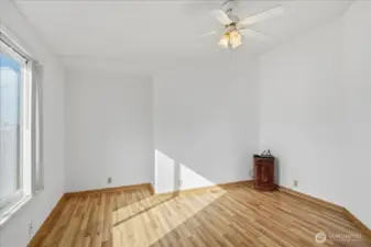 Den or office with large window for ample natural light.