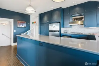 The modern kitchen has so many great features!  Designer colors and fixtures plus attractive subway tiles. The appliances are all stainless steel and there is a gas range for the gourmet chef!