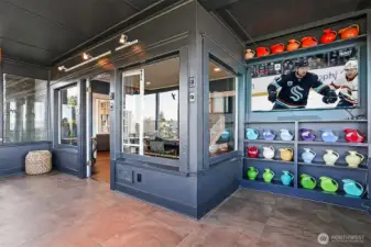 There is a TV nook in the Sun Room!  It's a great place to relax and watch your favorite team!  This angle looks back into the dining room.