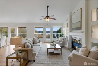 Relax in front of the gas fireplace on cool evenings.  French doors lead out to the huge deck for enjoying the views and a beverage or two!