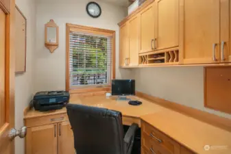 Nice main floor office with built in desk and cabinetry.  There is plumbing in this room to add a main floor laundry area if you so choose.