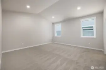 The primary bedroom has vaulted ceilings.