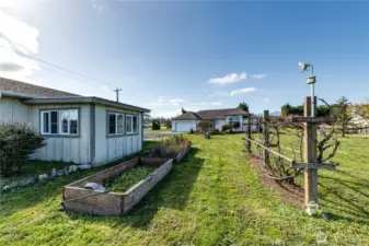 There are mature fruit trees, raspberries, rhubarb and grapevines. The garden space offers many options for expansion.