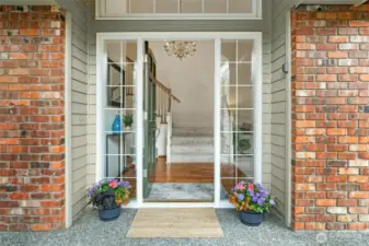 Enter this beautiful home with generously sized living areas, stunning refinished hardwood floors and brand new plush carpeting.  throughout.