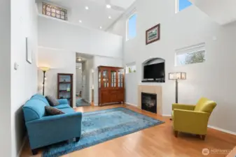 Notice the loft, ceiling fan, sun filled windows & fireplace