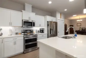 The island has an undermount sink and dishwasher.