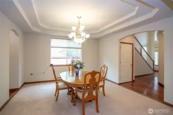Gather in the formal dining room with its graceful coved ceiling and space for memorable dinner parties.