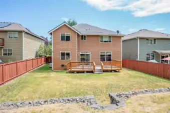View from the upper-level backyard—so much space to relax or play, whether you're lounging on the new 2023 deck or enjoying the open yard below.