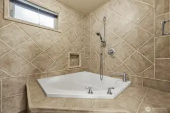 Deep soaking tub in primary bath.