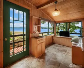 Upper level sun room/mudroom has great views.