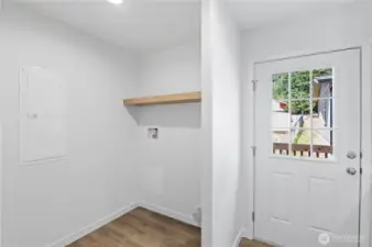 Utility Room with door leading to back deck