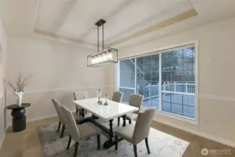 Formal dining room, virtually staged.