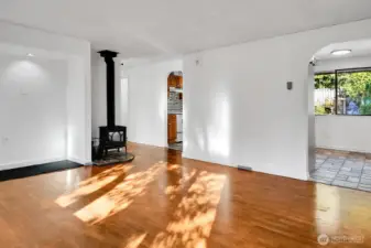 Spacious living room leads to the kitchen and dining area.