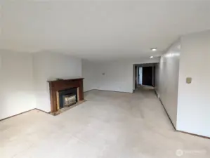 Large living rm with wood fireplace. Welcome to #11214 34th Ave E, Tacoma WA 98446. 3200+sf, 4+ br, 3 ba, 1.1 fenced acres.