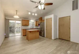 Kitchen with stainless appliances and new vinyl plank flooring